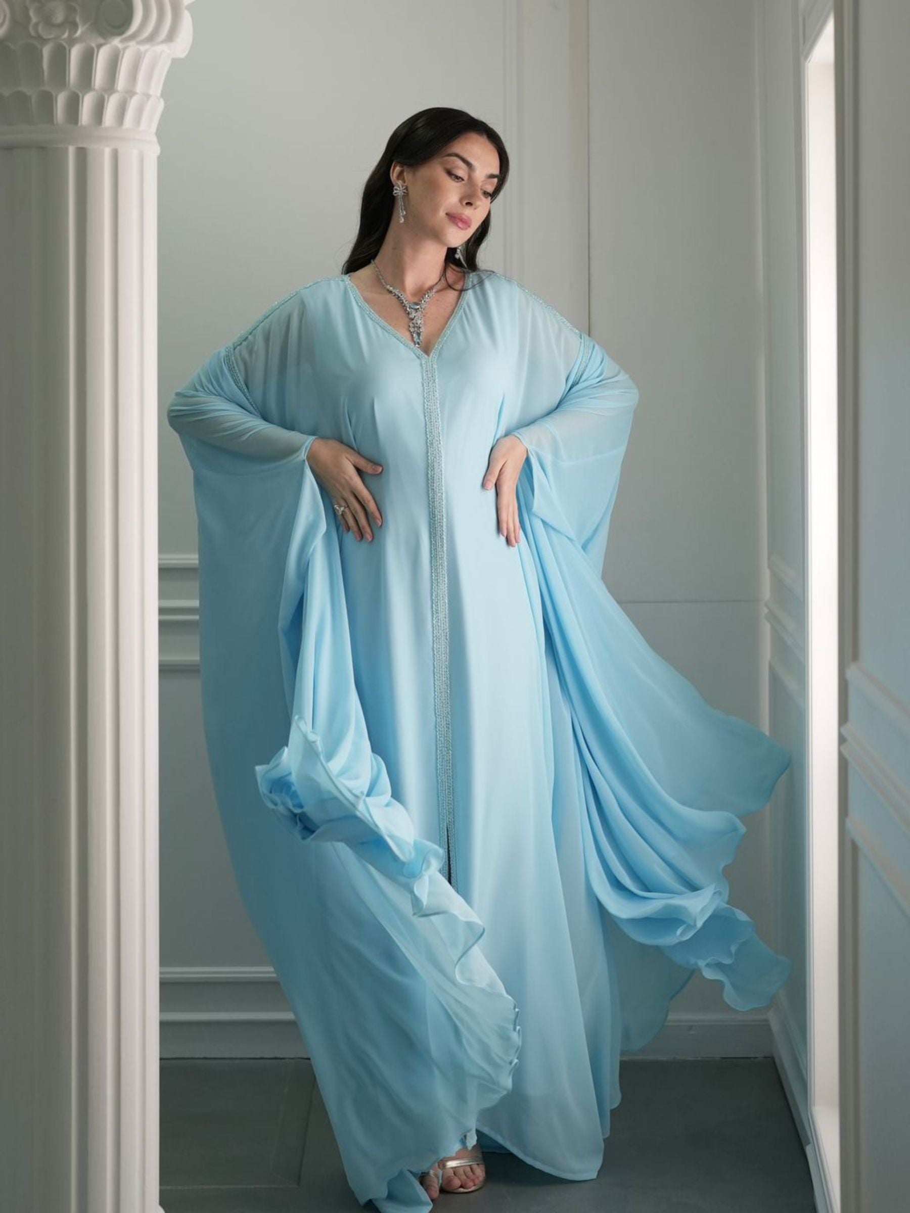 Woman wearing a light blue dress.