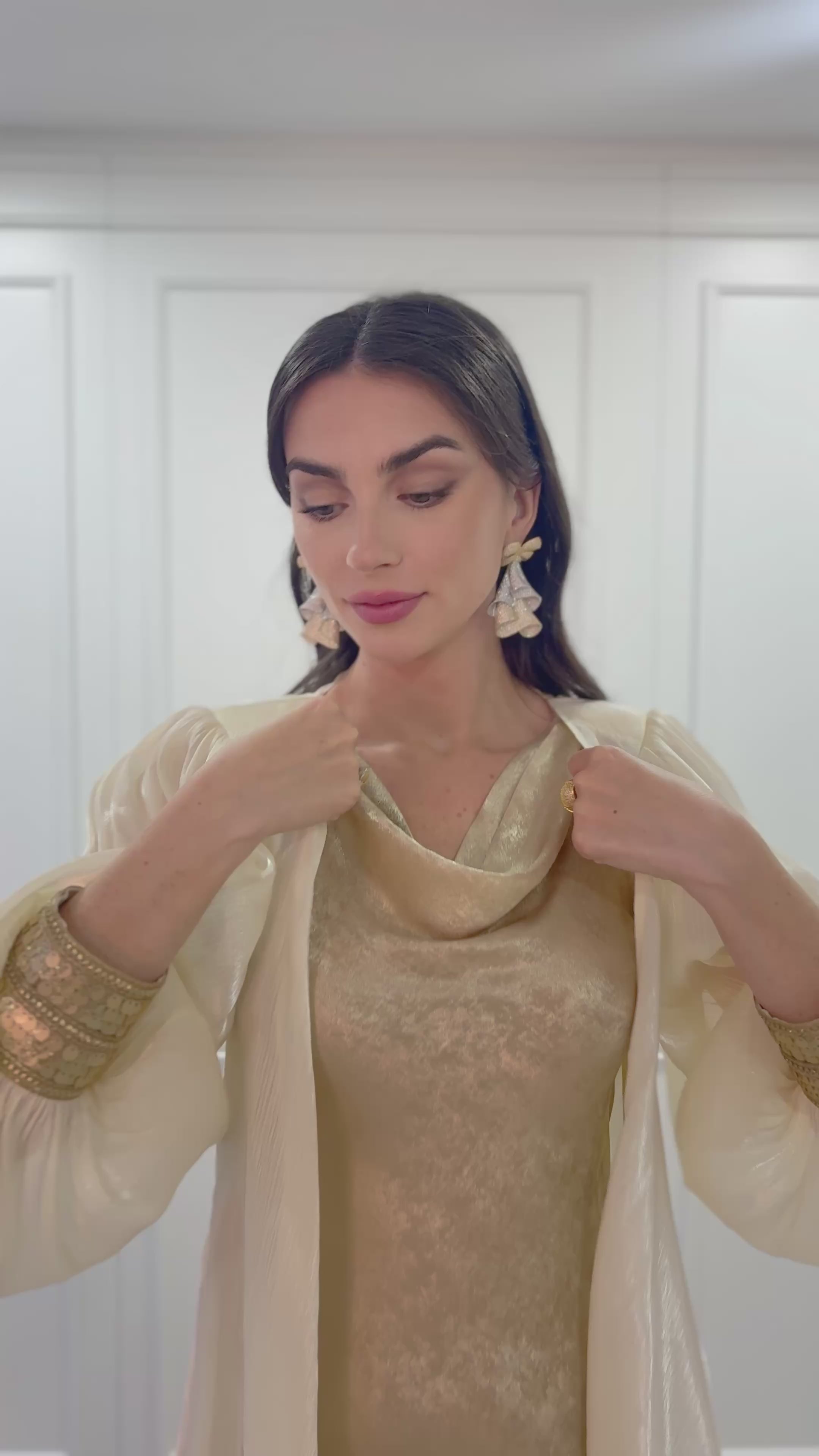 Maison Arabelle cream-colored traditional outfit with gold sequins.