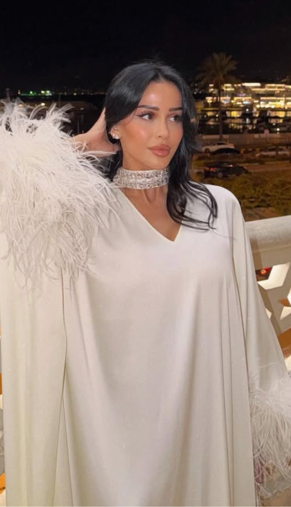 Khoury Reine embodies effortless elegance in our Maya Kaftan Feather
