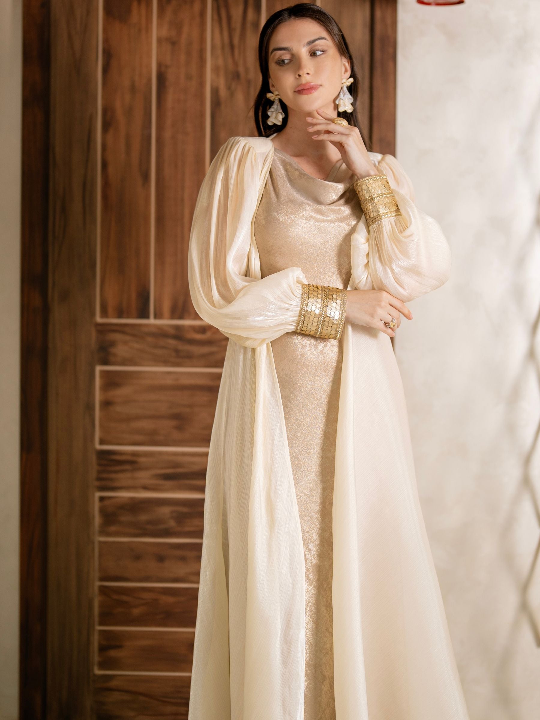 Maison Arabelle cream-colored traditional outfit with gold sequins.
