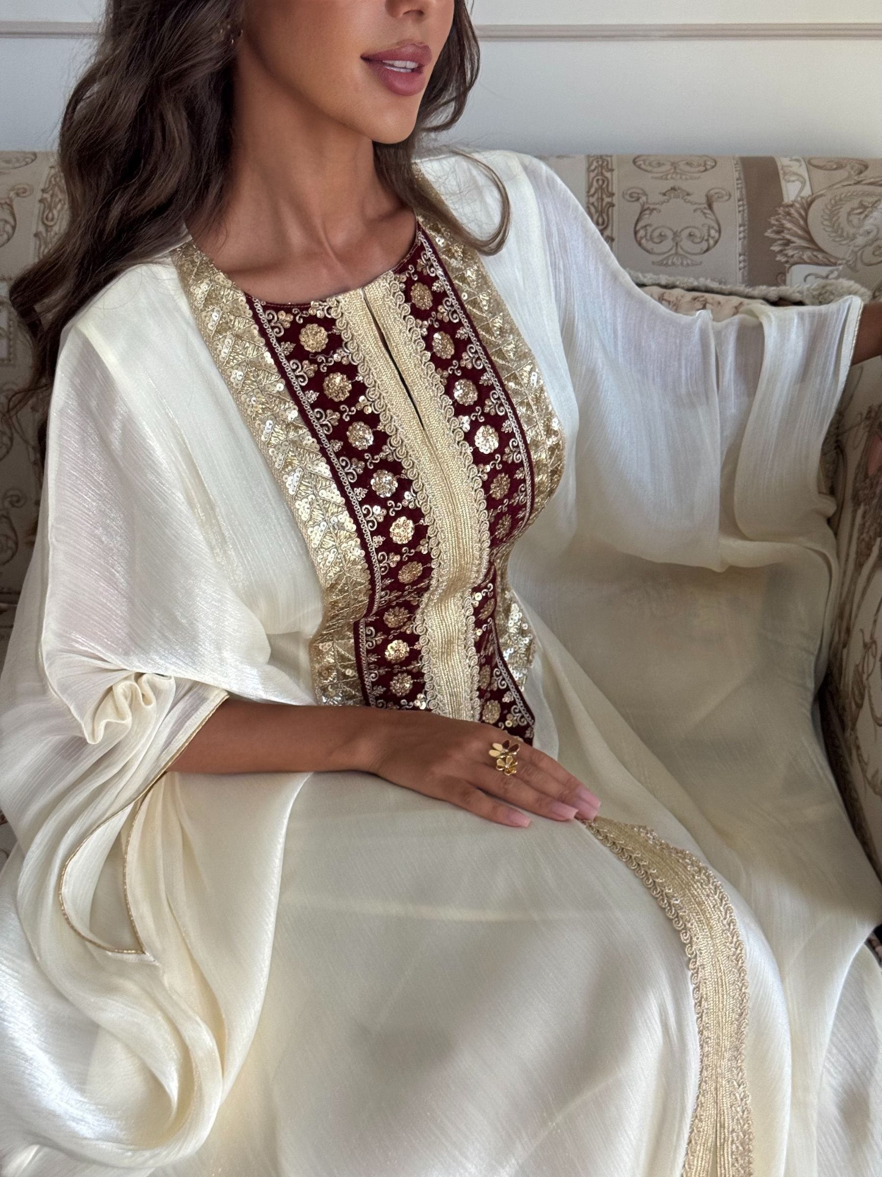 Maison Arabelle offwhite kaftan with gold and maroon embroidery.